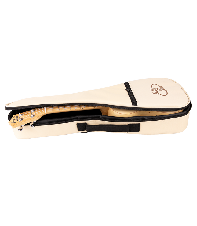 A bamboo ukulele inside a cream colored gig bag with Eddy Finn branding