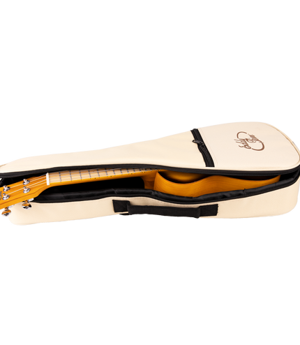 A ukulele inside a cream colored gig bag with Eddy Finn branding