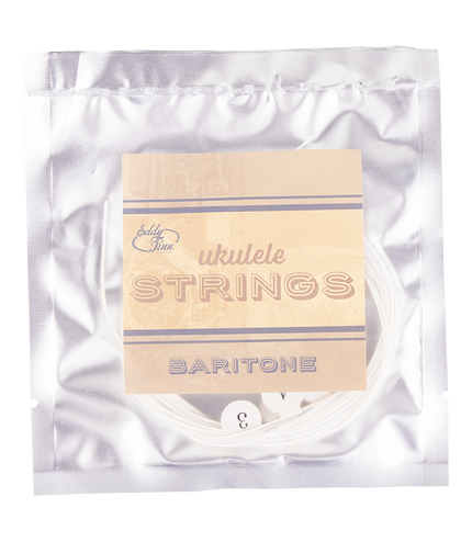 A clear package of baritone ukulele string with silver backing