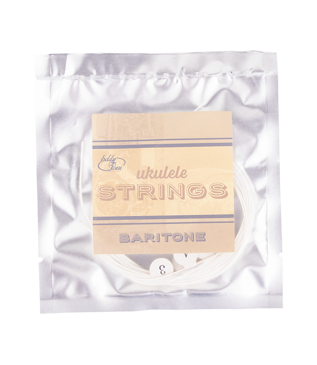 A clear package of baritone ukulele string with silver backing