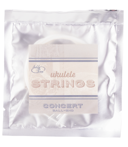 A clear package of concert ukulele strings with silver backing
