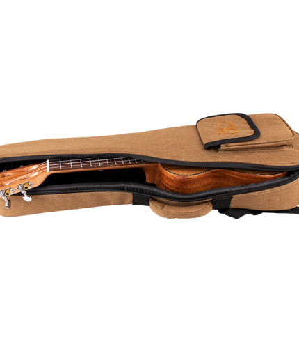 A ukulele inside a tan colored gig bag with Eddy Finn branding