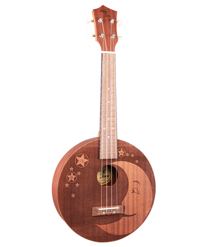 A mahogany ukulele with a round body that has moon and star designs