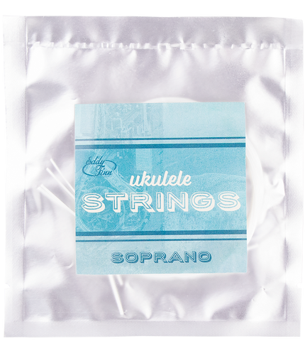 A clear package with soprano ukulele strings on a silver backing