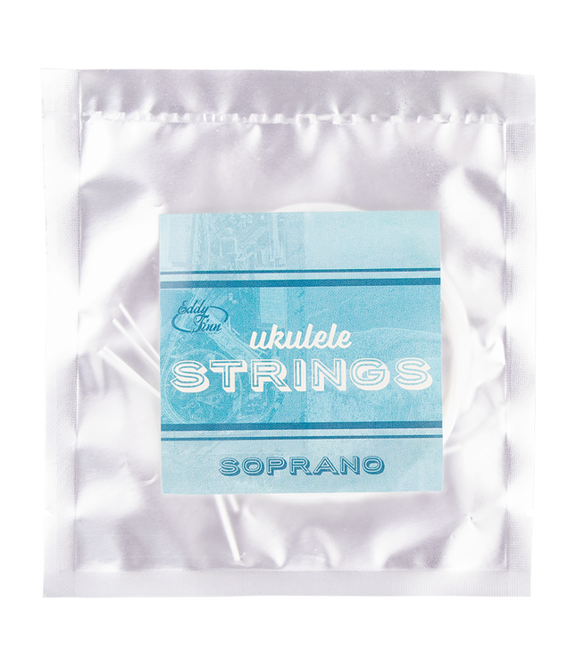 A clear package with soprano ukulele strings on a silver backing